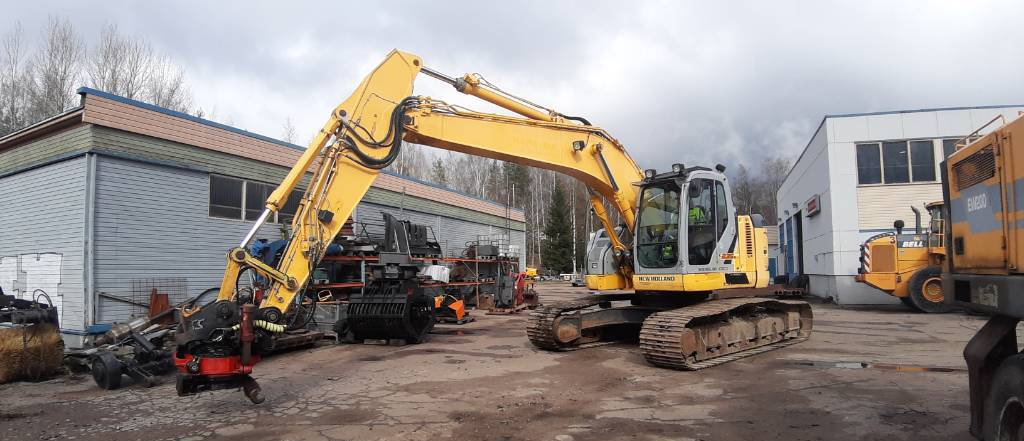 Pelle sur chenille New Holland E 235 B SR-2: photos 3