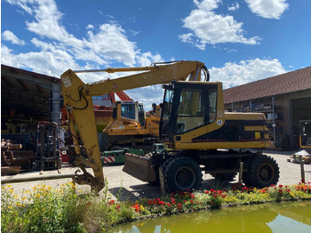 Pelle sur pneus Caterpillar M 312: photos 2