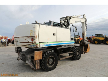 Pelle sur pneus New Holland MH 6.6 + Sandvic Hammer: photos 4