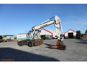 Pelle sur pneus New Holland MH 6.6 + Sandvic Hammer: photos 2