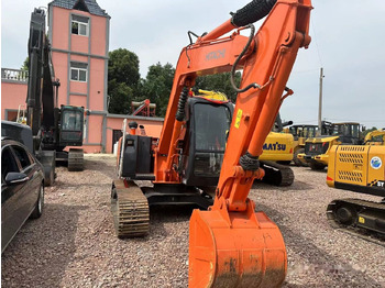 Pelle sur chenille Hitachi ZX70: photos 2