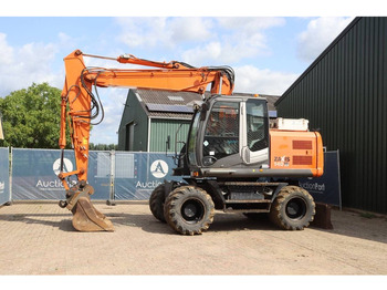 Pelle sur pneus HITACHI ZX140W-3
