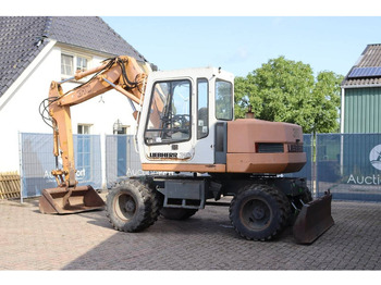 Pelle sur pneus Liebherr A 310: photos 3