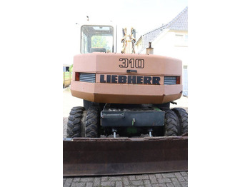 Pelle sur pneus Liebherr A 310: photos 5