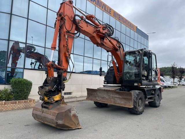 Hitachi ZX140W-5B - Pelle sur pneus: photos 1 Hitachi ZX140W-5B - Pelle sur pneus: photos 1