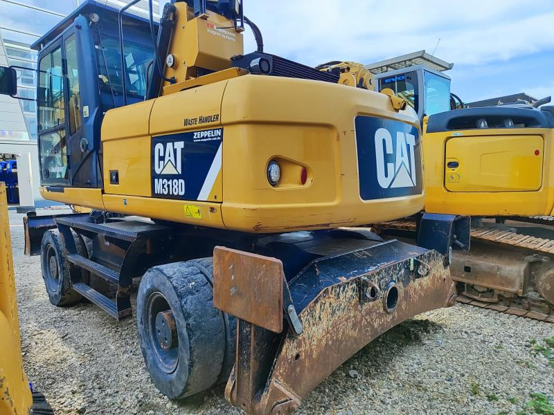 Caterpillar M318D MH - Pelle sur pneus: photos 1 Caterpillar M318D MH - Pelle sur pneus: photos 1