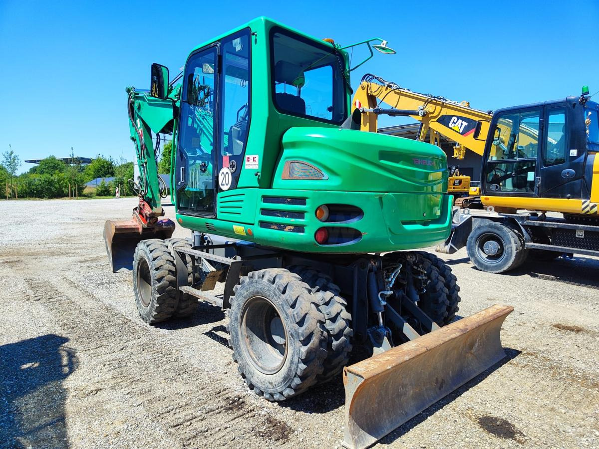 Takeuchi TB295W - Pelle sur pneus: photos 1 Takeuchi TB295W - Pelle sur pneus: photos 1