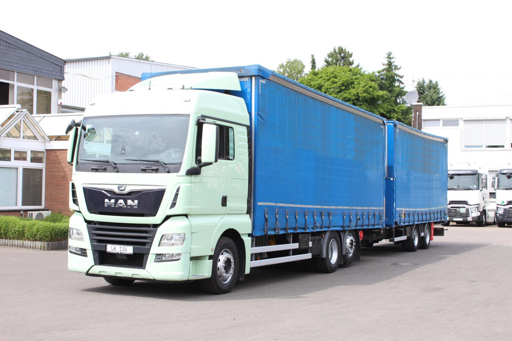 MAN TGX 26.460 Jumbo Retarder Hubdach Durchlade - Camion à rideaux coulissants: photos 1 MAN TGX 26.460 Jumbo Retarder Hubdach Durchlade - Camion à rideaux coulissants: photos 1