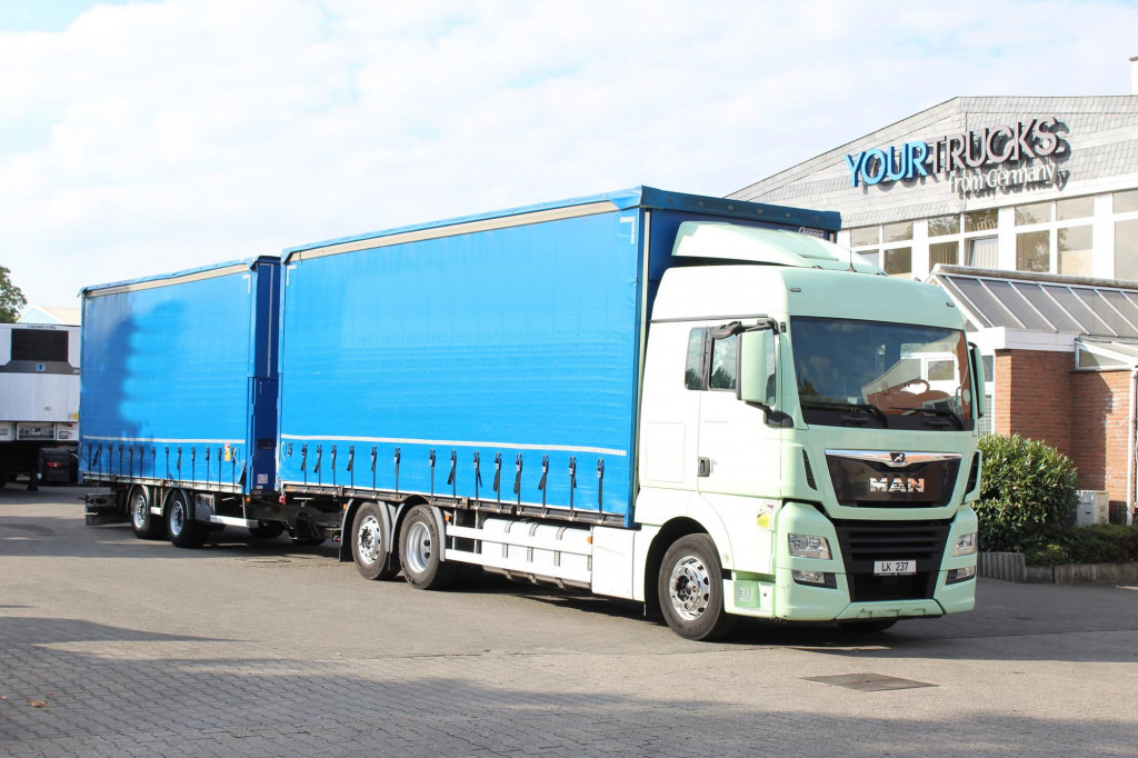 MAN TGX 26.460 Retarder Plane-Zug 120M3 Durchlade - Camion à rideaux coulissants: photos 1 MAN TGX 26.460 Retarder Plane-Zug 120M3 Durchlade - Camion à rideaux coulissants: photos 1