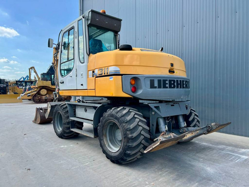 Liebherr A311 Litronic - Pelle sur pneus: photos 2 Liebherr A311 Litronic - Pelle sur pneus: photos 2