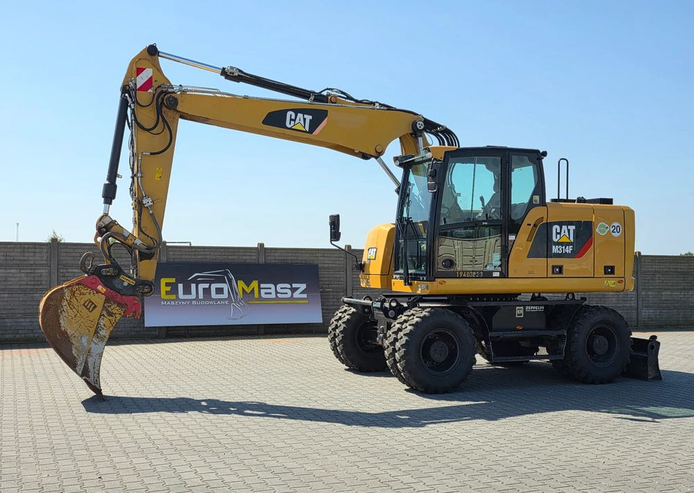 Caterpillar M314F, 2019 ROK, 3300 MTH, OIL QUICK OQ 65 - Pelle sur pneus: photos 1 Caterpillar M314F, 2019 ROK, 3300 MTH, OIL QUICK OQ 65 - Pelle sur pneus: photos 1