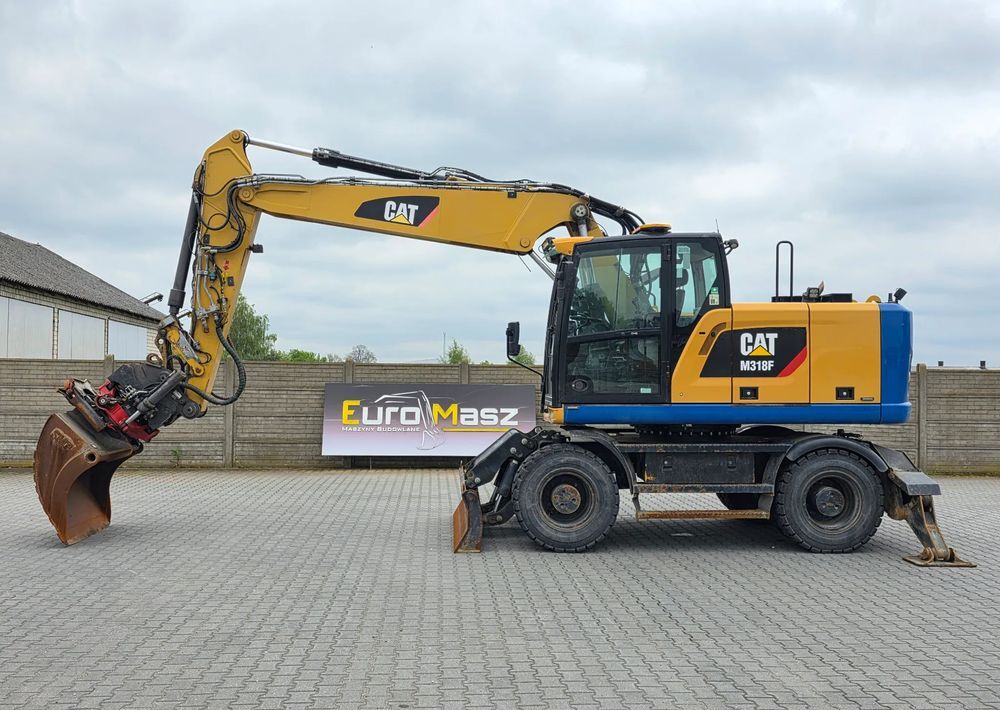 Caterpillar M318F, 2018 ROK, PODPORY + PŁUG, ROTOTILT - Pelle sur pneus: photos 2 Caterpillar M318F, 2018 ROK, PODPORY + PŁUG, ROTOTILT - Pelle sur pneus: photos 2