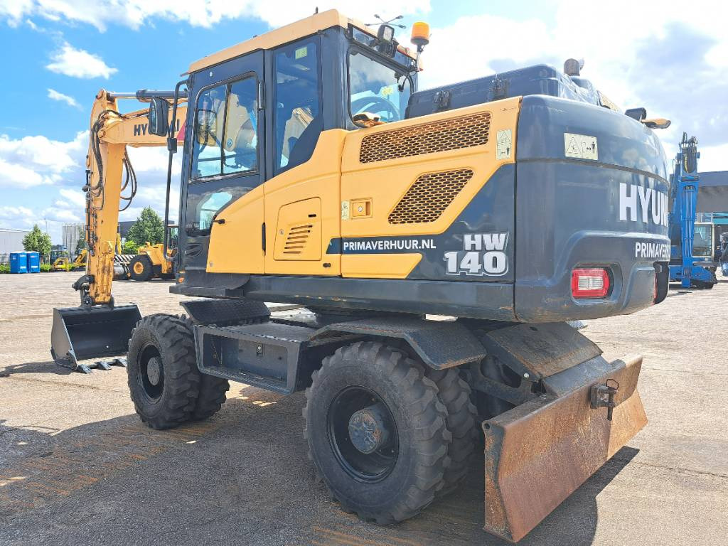 Hyundai HW140 - Pelle sur pneus: photos 1 Hyundai HW140 - Pelle sur pneus: photos 1