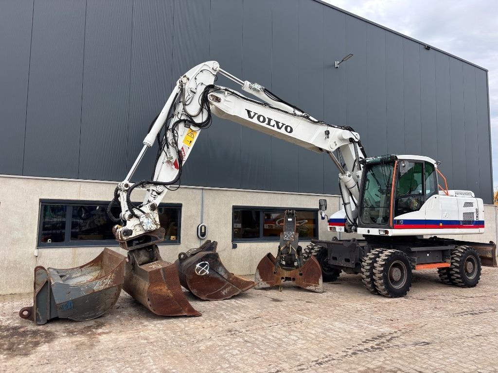 Volvo EW 210 D - EW210 - EW210D - EW 180 - EW 240 - Pelle sur pneus: photos 1 Volvo EW 210 D - EW210 - EW210D - EW 180 - EW 240 - Pelle sur pneus: photos 1