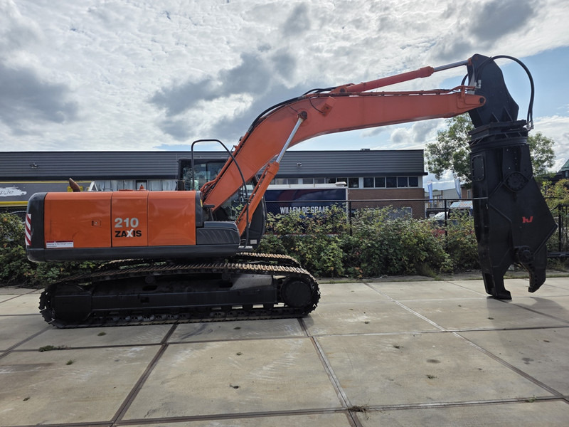 Hitachi zx210 scrap shear verachtert genesis labounty italmek sennebogen liebherr - Pelle de manutention: photos 1 Hitachi zx210 scrap shear verachtert genesis labounty italmek sennebogen liebherr - Pelle de manutention: photos 1