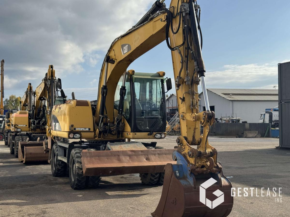 Caterpillar M313D - Pelle sur pneus: photos 4 Caterpillar M313D - Pelle sur pneus: photos 4
