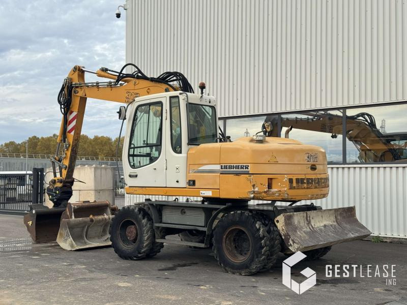 Liebherr A312 Litronic - Pelle sur pneus: photos 2 Liebherr A312 Litronic - Pelle sur pneus: photos 2