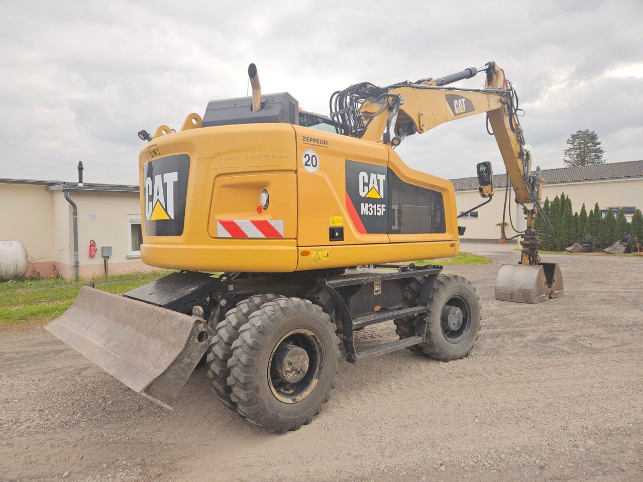 CAT M315F, orig. 2.828h - Pelle sur pneus: photos 3 CAT M315F, orig. 2.828h - Pelle sur pneus: photos 3