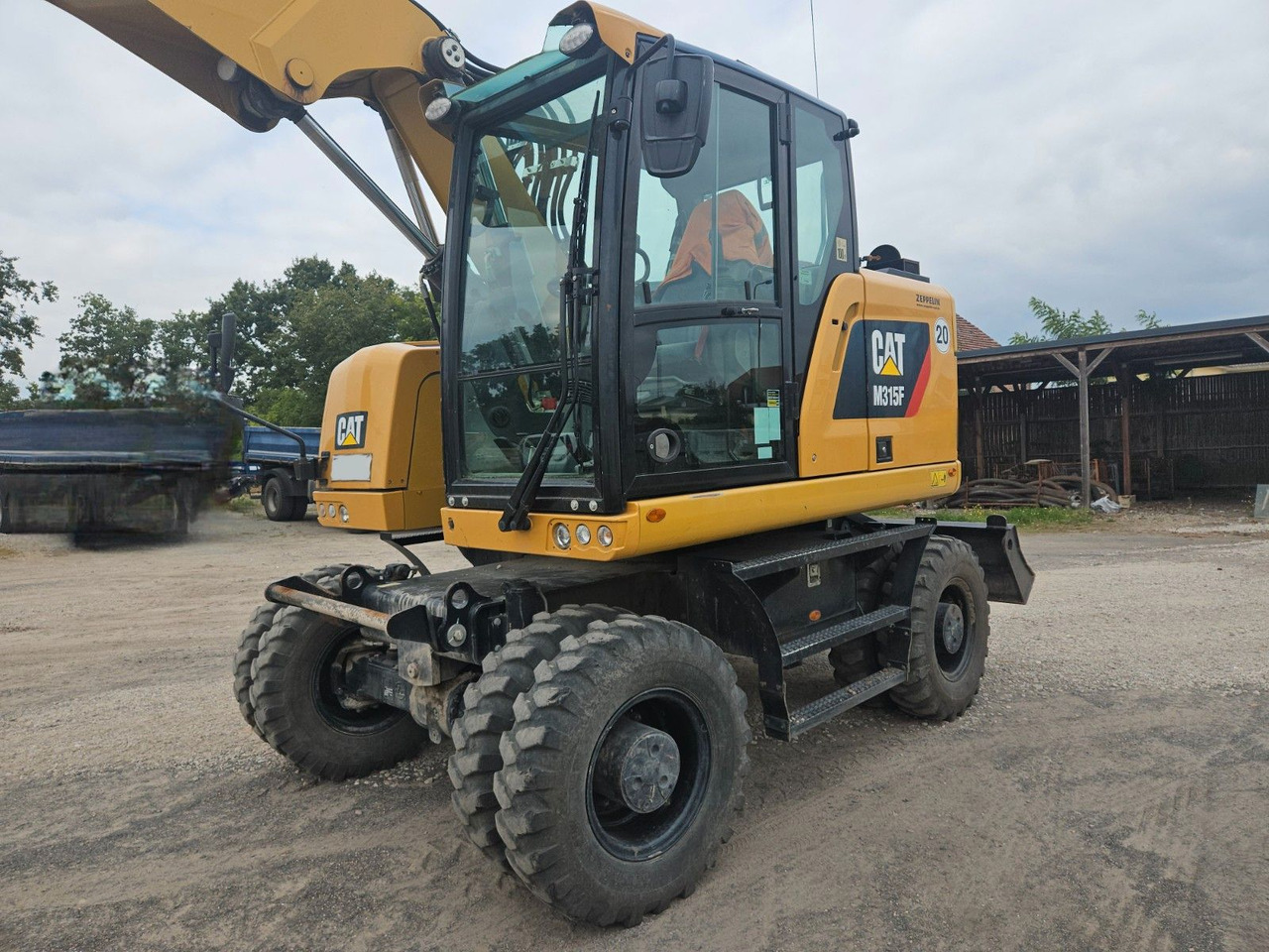 CAT M315F, orig. 2.828h - Pelle sur pneus: photos 4 CAT M315F, orig. 2.828h - Pelle sur pneus: photos 4