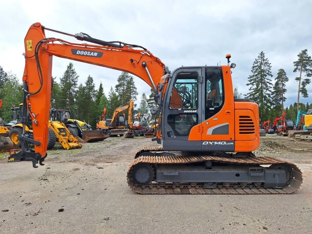 Doosan DX140LCR-5 PYÖRITTÄJÄLLÄ - Pelle sur chenille: photos 1 Doosan DX140LCR-5 PYÖRITTÄJÄLLÄ - Pelle sur chenille: photos 1