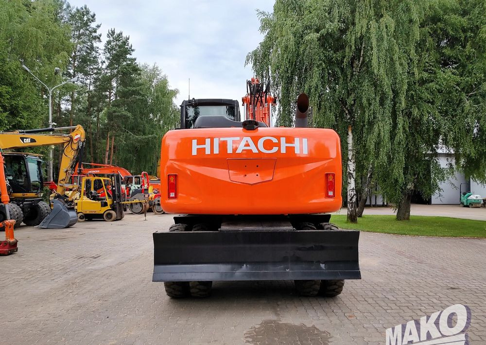Hitachi ZX 140 - Pelle sur pneus: photos 3 Hitachi ZX 140 - Pelle sur pneus: photos 3