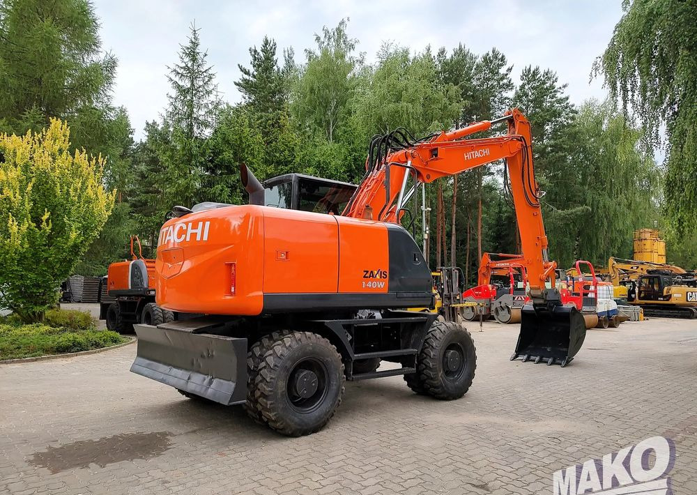 Hitachi ZX 140 - Pelle sur pneus: photos 4 Hitachi ZX 140 - Pelle sur pneus: photos 4