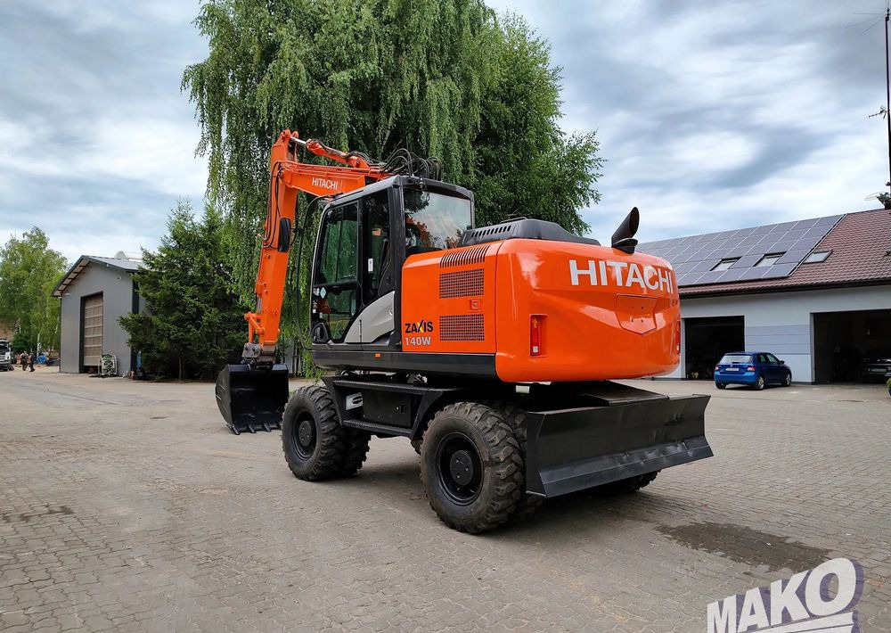 Hitachi ZX 140 - Pelle sur pneus: photos 2 Hitachi ZX 140 - Pelle sur pneus: photos 2
