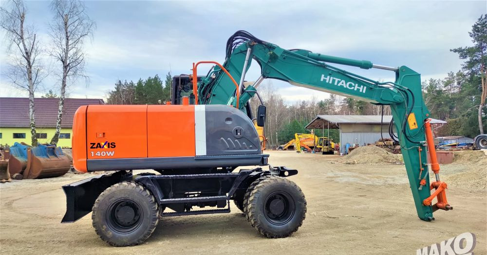 Hitachi ZX140W-3 - Pelle sur pneus: photos 5 Hitachi ZX140W-3 - Pelle sur pneus: photos 5