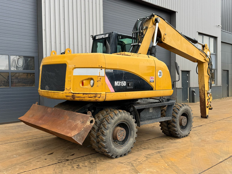 Pelle sur pneus Caterpillar M315D: photos 8
