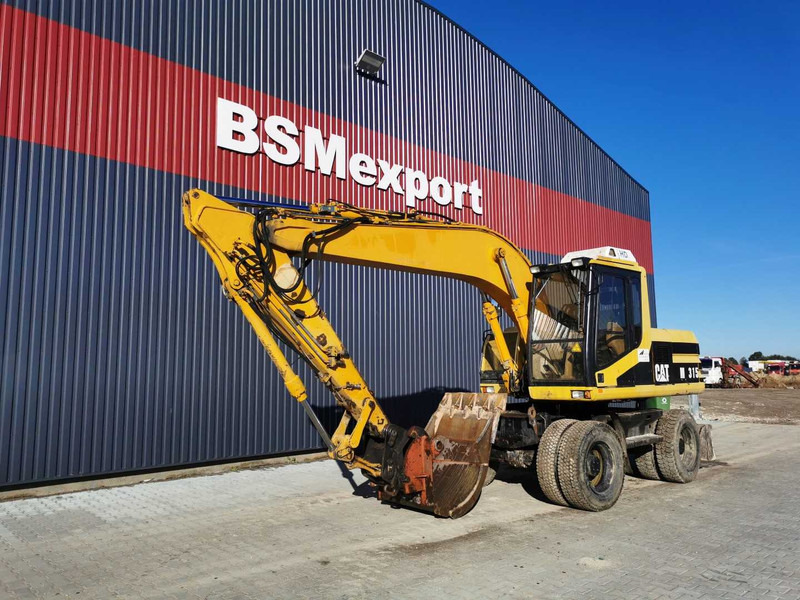 Caterpillar M315 wheel excavator - Pelle sur pneus: photos 2 Caterpillar M315 wheel excavator - Pelle sur pneus: photos 2