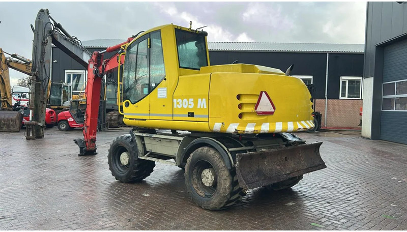 Atlas 1305 - Pelle sur pneus: photos 4 Atlas 1305 - Pelle sur pneus: photos 4