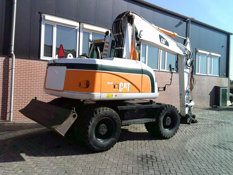 Caterpillar M313D - Pelle sur pneus: photos 4 Caterpillar M313D - Pelle sur pneus: photos 4