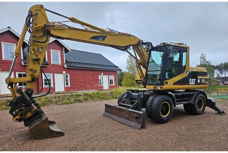 Caterpillar M312 Engcon EC20 tiltrotator - Pelle sur pneus: photos 1 Caterpillar M312 Engcon EC20 tiltrotator - Pelle sur pneus: photos 1