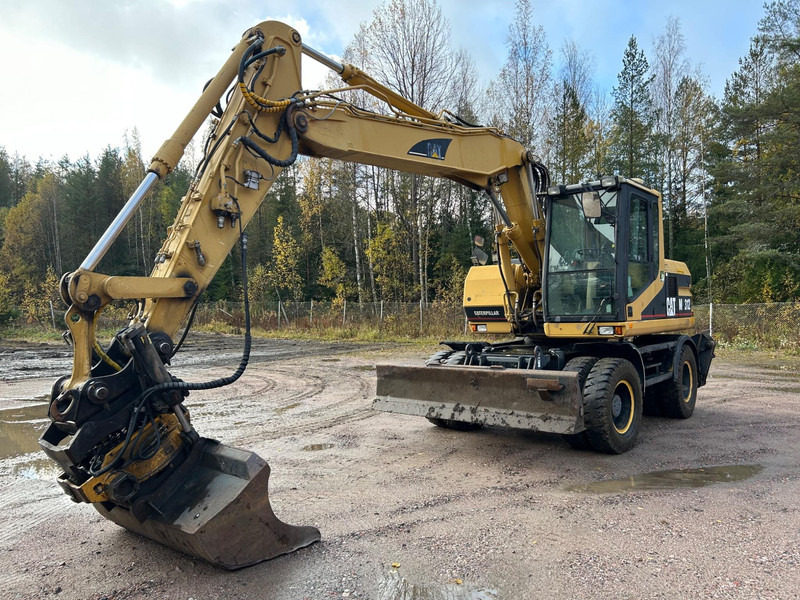 Caterpillar M312 Engcon EC20 tiltrotator - Pelle sur pneus: photos 1 Caterpillar M312 Engcon EC20 tiltrotator - Pelle sur pneus: photos 1