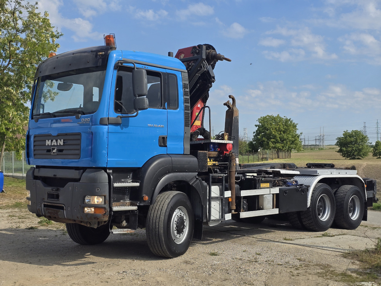 MAN TGA 33.430 6X6 / HMF 1823 K3+REM.CON./ HOOK SYSTEM - Camion ampliroll, Camion grue: photos 3 MAN TGA 33.430 6X6 / HMF 1823 K3+REM.CON./ HOOK SYSTEM - Camion ampliroll, Camion grue: photos 3