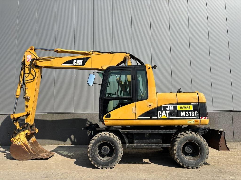 CAT M 313 C (Low verified hours) - Pelle sur pneus: photos 1 CAT M 313 C (Low verified hours) - Pelle sur pneus: photos 1