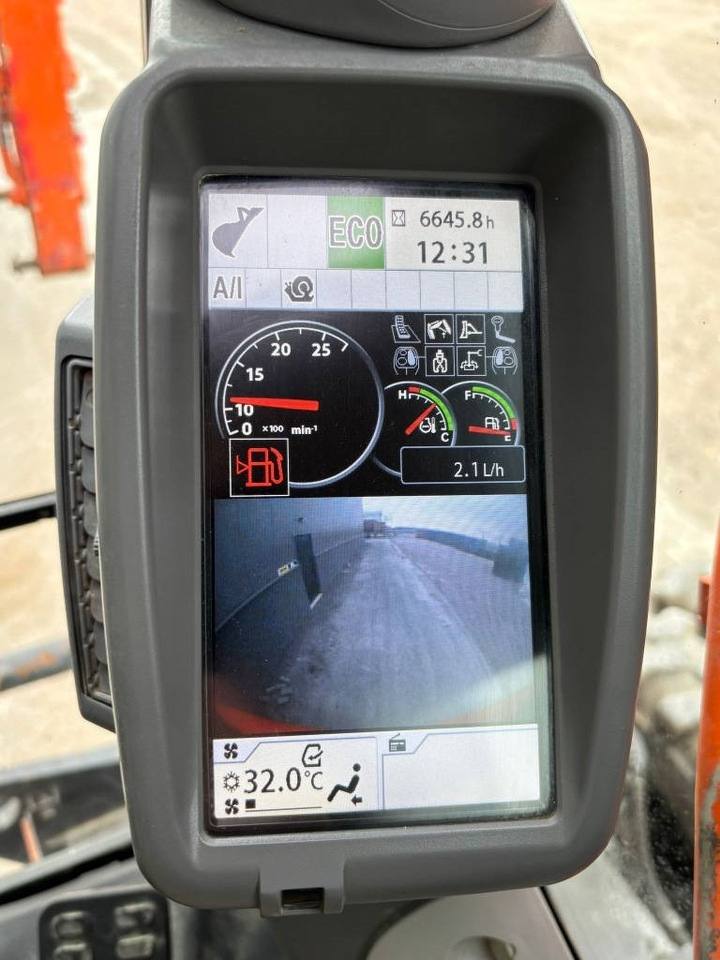 Pelle sur pneus Hitachi ZX 140 W-5B: photos 9