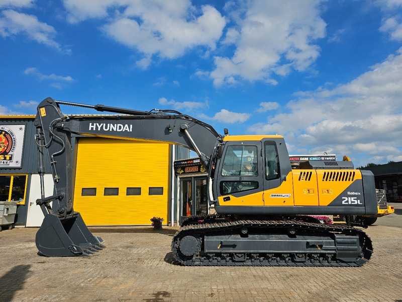 Hyundai R215L - Pelle sur chenille: photos 1 Hyundai R215L - Pelle sur chenille: photos 1