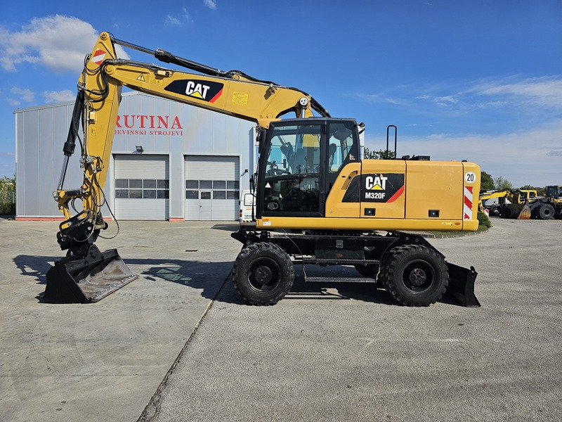 CATERPILLAR M320F - Pelle sur pneus: photos 1 CATERPILLAR M320F - Pelle sur pneus: photos 1