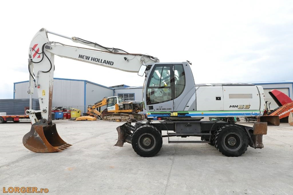 Pelle sur pneus New Holland MH 6.6 + Sandvic Hammer: photos 7