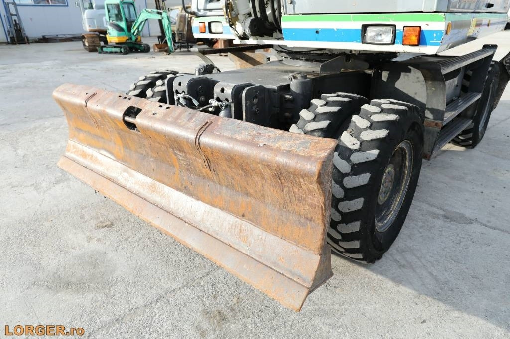 Pelle sur pneus New Holland MH 6.6 + Sandvic Hammer: photos 10