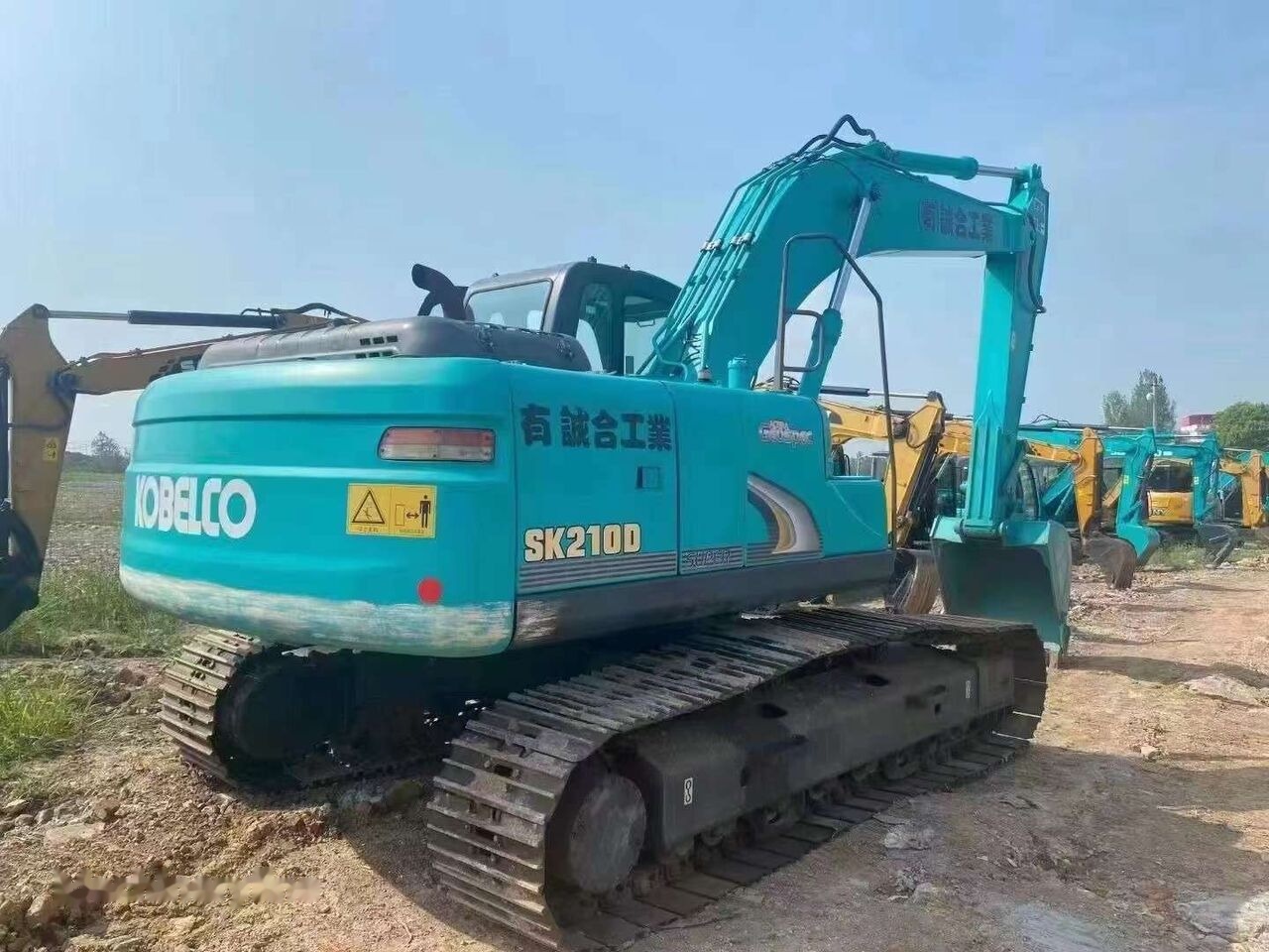Kobelco SK210D - Pelle sur chenille: photos 2 Kobelco SK210D - Pelle sur chenille: photos 2