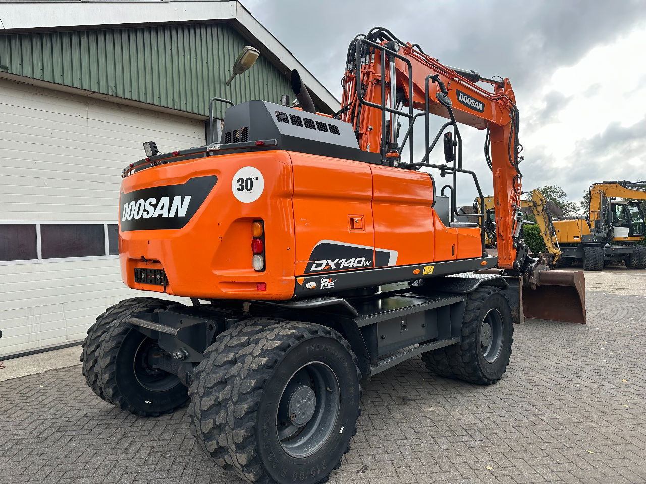 Doosan DX140W-5 - Pelle sur pneus: photos 4 Doosan DX140W-5 - Pelle sur pneus: photos 4