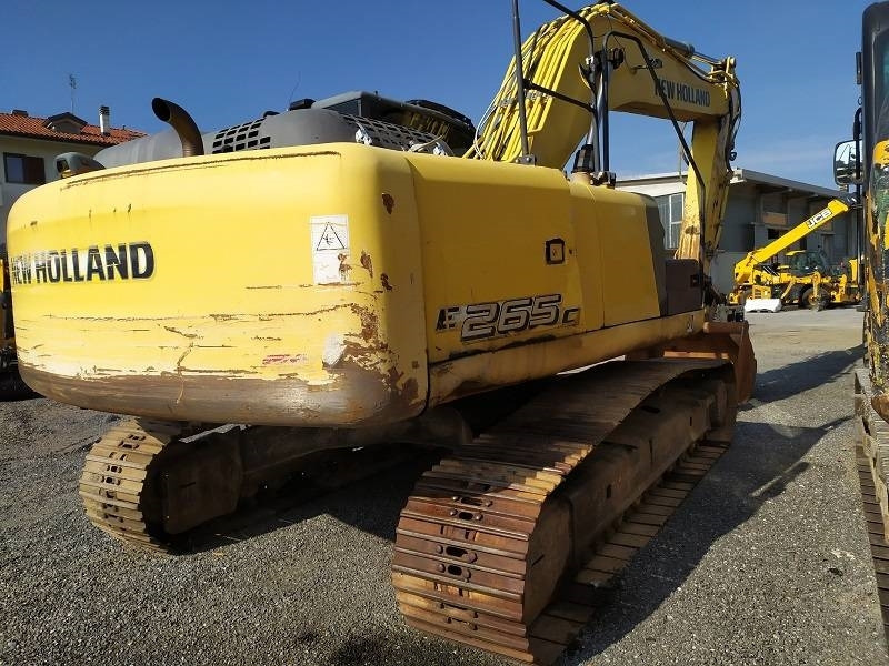 Pelle sur chenille New Holland E 265 C: photos 9