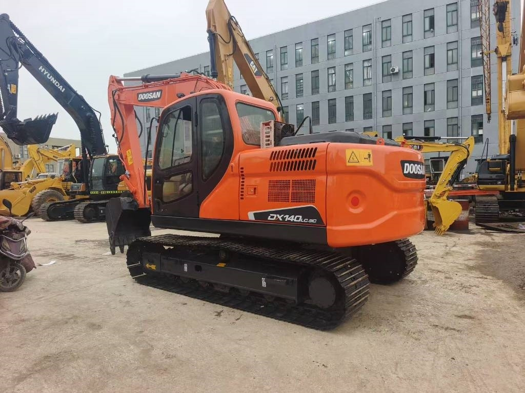Doosan DX 140 - Pelle sur chenille: photos 1 Doosan DX 140 - Pelle sur chenille: photos 1