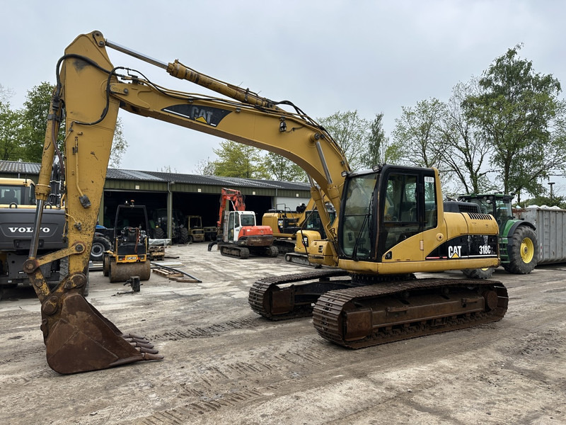 Caterpillar 318 CL - Pelle sur chenille: photos 1 Caterpillar 318 CL - Pelle sur chenille: photos 1