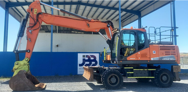 Doosan DX210W-5 - Pelle sur pneus: photos 1 Doosan DX210W-5 - Pelle sur pneus: photos 1