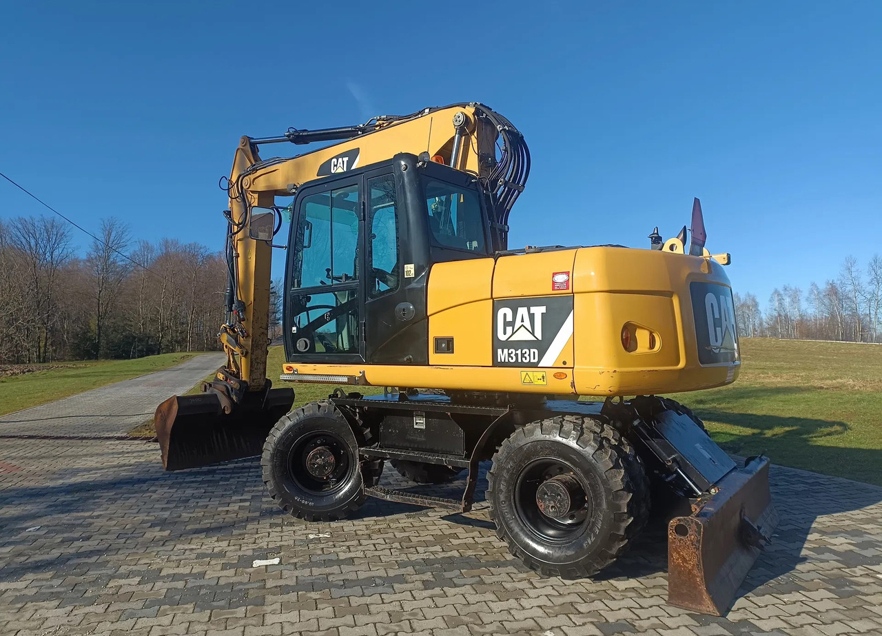 CATERPILLAR M313D - Pelle sur pneus: photos 1 CATERPILLAR M313D - Pelle sur pneus: photos 1