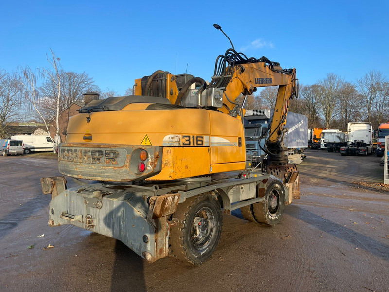 Liebherr A 316 - Pelle sur pneus: photos 3 Liebherr A 316 - Pelle sur pneus: photos 3