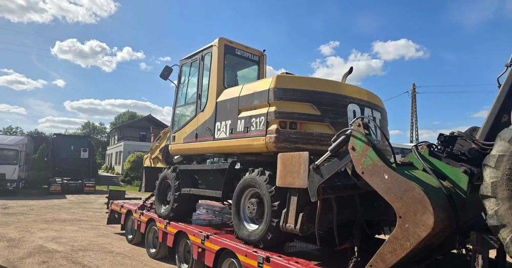 Caterpillar M312 - Pelle sur pneus: photos 4 Caterpillar M312 - Pelle sur pneus: photos 4